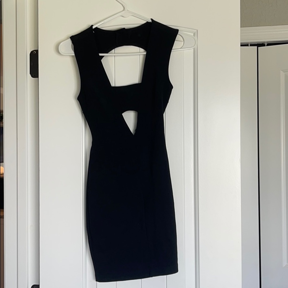 Backless black mini dress.